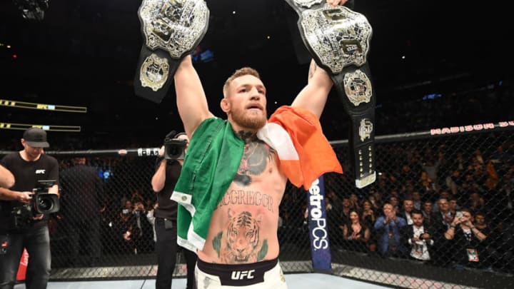 NEW YORK, NY - NOVEMBER 12: UFC lightweight and featherweight champion Conor McGregor of Ireland celebrates after defeating Eddie Alvarez in their UFC lightweight championship fight during the UFC 205 event at Madison Square Garden on November 12, 2016 in New York City. (Photo by Jeff Bottari/Zuffa LLC/Zuffa LLC via Getty Images)