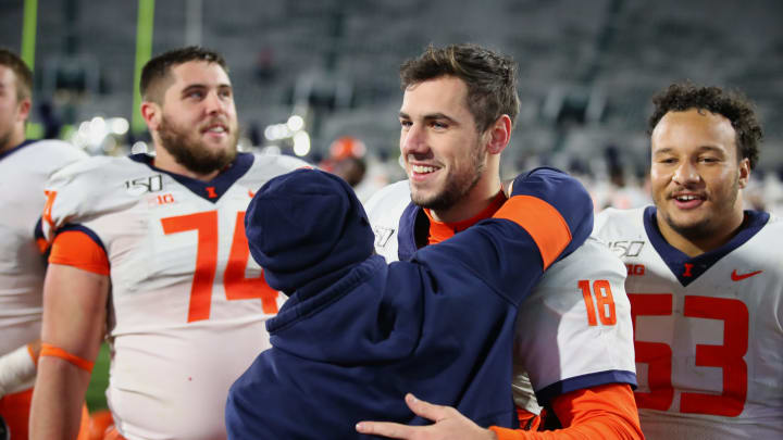 EAST LANSING, MICHIGAN – NOVEMBER 09: Brandon Peters #18 of the Illinois Fighting Illini celebrates a 37-34 come from behind win against the Michigan State Spartans at Spartan Stadium on November 09, 2019 in East Lansing, Michigan. (Photo by Gregory Shamus/Getty Images)