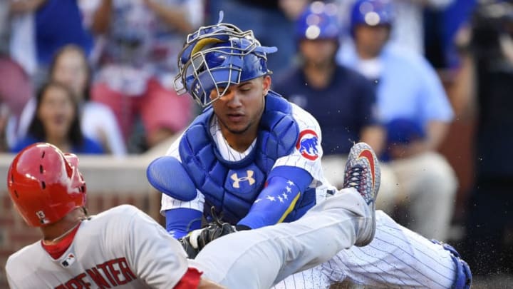 CHICAGO, IL - JULY 23: Chicago Cubs catcher Willson Contreras (40) tags out St. Louis Cardinals first baseman Matt Carpenter (13). (Photo by Quinn Harris/Icon Sportswire via Getty Images)