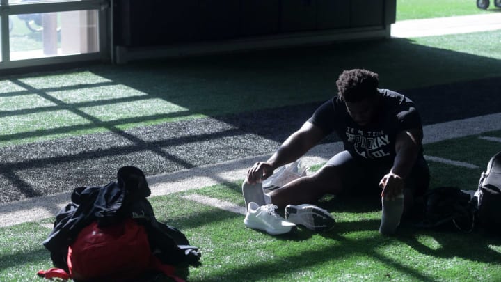 Texas Tech’s defensive lineman Gabe Oladipo stretches before Pro Day, Wednesday, March 29, 2023, at Sports Performance Center.