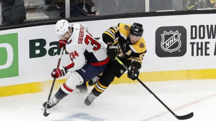 BOSTON, MA - NOVEMBER 16: Boston Bruins left wing Brad Marchand (63) gets past Washington Capitals defenseman Jonas Siegenthaler (34) during a game between the Boston Bruins and the Washington Capitals on November 16, 2019, at TD Garden in Boston, Massachusetts. (Photo by Fred Kfoury III/Icon Sportswire via Getty Images)