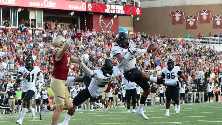CHESTNUT HILL, MASSACHUSETTS – SEPTEMBER 28: Justin Strnad #23 of the Wake Forest Demon Deacons and Essang Bassey #21 break up a pass intended for Danny Dalton #15 of the Boston College Eagles during the second half of the game between the Boston College Eagles and the Wake Forest Demon Deacons at Alumni Stadium on September 28, 2019 in Chestnut Hill, Massachusetts. The Demon Deacons defeat the Eagles 27-24. (Photo by Maddie Meyer/Getty Images)