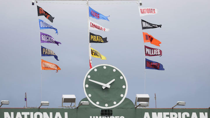 CHICAGO, IL - AUGUST 13: Flags fly above the scoreboard at Wrigley Field during a game between the Chicasgo Cubs and the St. Louis Cardinals on August 13, 2016 in Chicago, Illinois. (Photo by Jonathan Daniel/Getty Images)