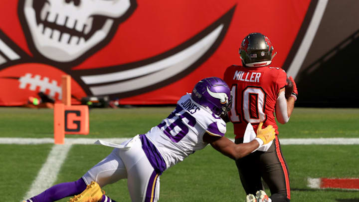 TAMPA, FLORIDA - DECEMBER 13: Scott Miller #10 of the Tampa Bay Buccaneers catches a touchdown pass while covered by Chris Jones #26 of the Minnesota Vikings at Raymond James Stadium on December 13, 2020 in Tampa, Florida. (Photo by Mike Ehrmann/Getty Images) TAMPA, FLORIDA - DECEMBER 13: Scott Miller #10 of the Tampa Bay Buccaneers catches a touchdown pass while covered by Chris Jones #26 of the Minnesota Vikings at Raymond James Stadium on December 13, 2020 in Tampa, Florida. (Photo by Mike Ehrmann/Getty Images)