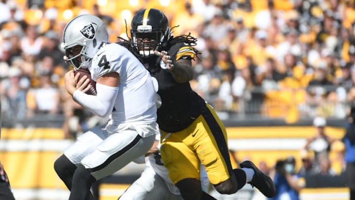 Sep 19, 2021; Pittsburgh, Pennsylvania, USA; Las Vegas Raiders quarterback Derek Carr is sacked by Pittsburgh Steelers linebac ker Melvin Ingram III during the fourth quarter at Heinz Field. Mandatory Credit: Philip G. Pavely-USA TODAY Sports