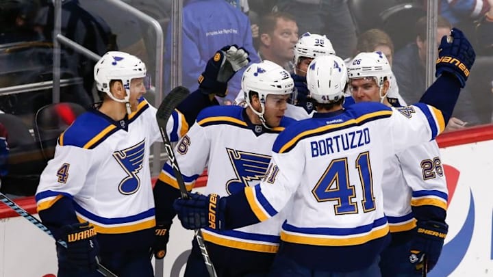 Apr 3, 2016; Denver, CO, USA; St. Louis Blues left wing Magnus Paajarvi (56) celebrates with teammates defenseman Robert Bortuzzo (41) center Paul Stastny (26) right wing Troy Brouwer (36) and defenseman Carl Gunnarsson (4) after scoring a goal in the first period against the Colorado Avalanche at the Pepsi Center. Mandatory Credit: Isaiah J. Downing-USA TODAY Sports