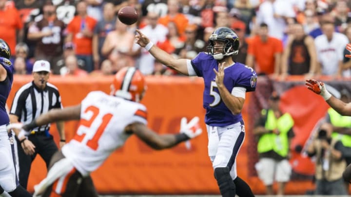CLEVELAND, OH - SEPTEMBER 18: Quarterback Joe Flacco #5 of the Baltimore Ravens passes while under pressure from defensive back Jamar Taylor #21 of the Cleveland Browns during the first half at FirstEnergy Stadium on September 18, 2016 in Cleveland, Ohio. (Photo by Jason Miller/Getty Images)