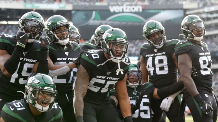 EAST RUTHERFORD, NEW JERSEY - DECEMBER 08: (NEW YORK DAILIES OUT) The New York Jets defense celebrates an interception against the Miami Dolphins at MetLife Stadium on December 08, 2019 in East Rutherford, New Jersey. The Jets defeated the Dolphins 22-21. (Photo by Jim McIsaac/Getty Images)