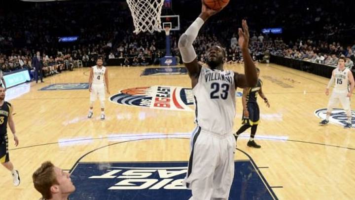 Mar 12, 2015; New York, NY, USA; Villanova Wildcats forward Daniel Ochefu (23) shoots during the game against the Marquette Golden Eagles at Madison Square Garden. Mandatory Credit: Robert Deutsch-USA TODAY Sports Mar 12, 2015; New York, NY, USA; Villanova Wildcats forward Daniel Ochefu (23) shoots during the game against the Marquette Golden Eagles at Madison Square Garden. Mandatory Credit: Robert Deutsch-USA TODAY Sports