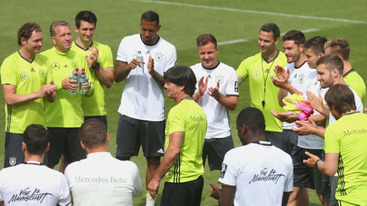 ASCONA, SWITZERLAND - JUNE 03: Players and coaches of Germany celebrate the birthday of her team mate Mario Goetze (C) prior to a training session at stadio communale on day 11 of the German national team trainings camp on June 3, 2016 in Ascona, Switzerland. (Photo by Alexander Hassenstein/Bongarts/Getty Images)