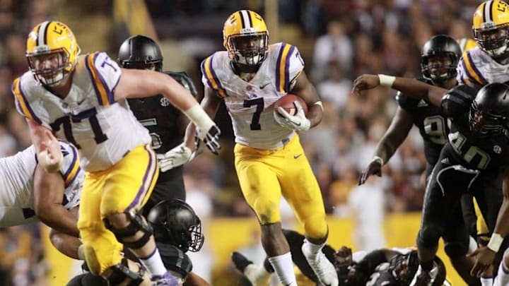 Nov 28, 2015; Baton Rouge, LA, USA; LSU Tigers running back Leonard Fournette (7) carries the ball in the second half against the Texas A&M Aggies at Tiger Stadium. LSU defeated Texas A&M Aggies 19-7. Mandatory Credit: Crystal LoGiudice-USA TODAY Sports