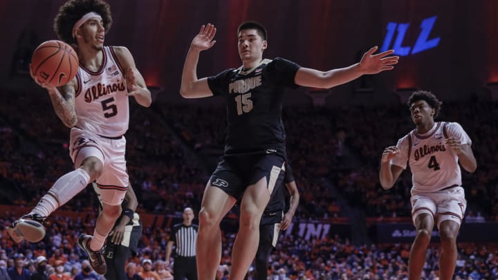 CHAMPAIGN, IL – JANUARY 17: Andre Curbelo #5 of the Illinois Fighting Illini passes the ball against Zach Edey #15 of the Purdue Boilermakers during the first half at State Farm Center on January 17, 2022 in Champaign, Illinois. (Photo by Michael Hickey/Getty Images)