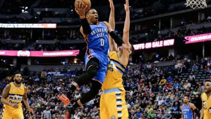 Nov 25, 2016; Denver, CO, USA; Oklahoma City Thunder guard Russell Westbrook (0) shoots over Denver Nuggets forward Nikola Jokic (15) in the fourth quarter at the Pepsi Center. The Thunder won 132-129. Mandatory Credit: Isaiah J. Downing-USA TODAY Sports