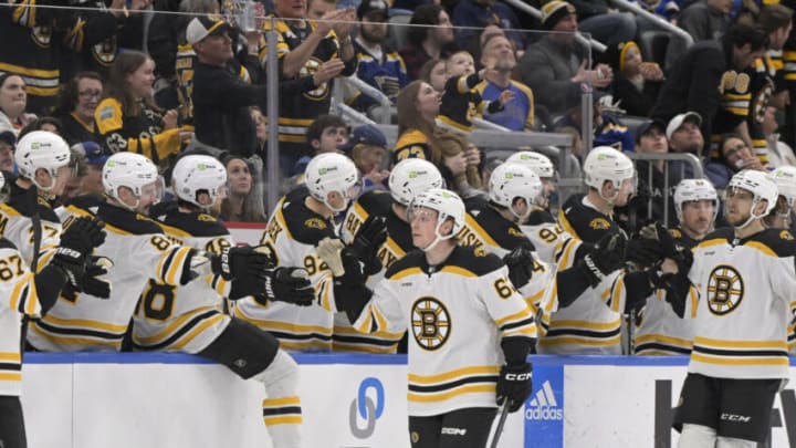 Apr 2, 2023; St. Louis, Missouri, USA; Boston Bruins Oskar Steen (29) is congratulated by teammates after scoring a goal against the St. Louis Blues during the second period at Enterprise Center. Mandatory Credit: Jeff Le-USA TODAY Sports