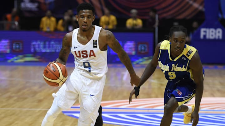 CORDOBA, ARGENTINA - SEPTEMBER 02: Xavier Munford of United States dribbles the ball past Stephaun Adams of Virgin Islands during the FIBA Americup semi final match between US and Virgin Islands at Orfeo Superdomo arena on September 2, 2017 in Cordoba, Argentina. NOTE TO USER: User expressly acknowledges and agrees that, by downloading and/or using this Photograph, user is consenting to the terms and conditions of the Getty Images License Agreement. Mandatory Copyright Notice: Copyright 2017 NBAE (Photo by Marcelo Endelli/NBAE via Getty Images)