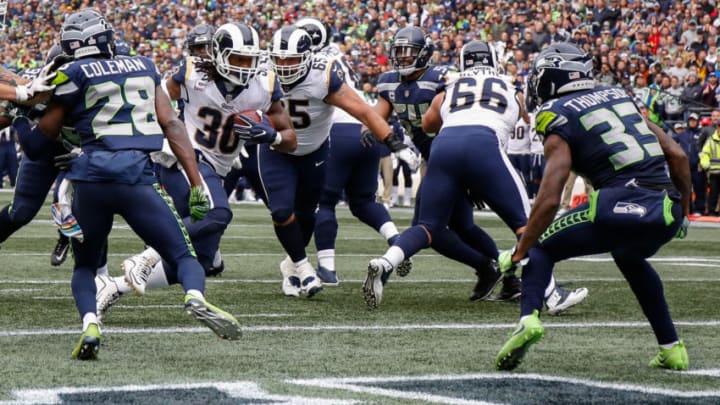 SEATTLE, WA - OCTOBER 07: Running Back Todd Gurley III #30 of the Los Angeles Rams scores a touchdown during the second half against the Seattle Seahawks at CenturyLink Field on October 7, 2018 in Seattle, Washington. (Photo by Otto Greule Jr/Getty Images)