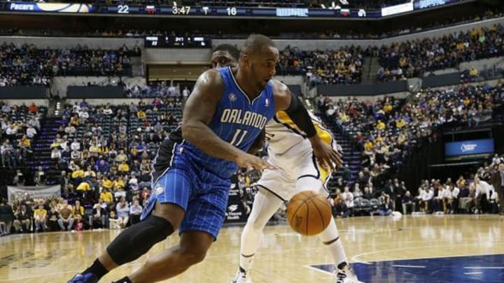 Feb 3, 2014; Indianapolis, IN, USA; Orlando Magic center Glen Davis (11) drives to the basket against Indiana Pacers center Roy Hibbert (55) at Bankers Life Fieldhouse. Mandatory Credit: Brian Spurlock-USA TODAY Sports