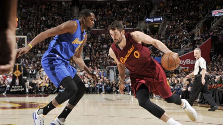 CLEVELAND, OH - DECEMBER 25: Kevin Love #0 of the Cleveland Cavaliers drives to the basket against Kevin Durant #35 of the Golden State Warriors during the game on December 25, 2016 at Quicken Loans Arena in Cleveland, Ohio. NOTE TO USER: User expressly acknowledges and agrees that, by downloading and/or using this Photograph, user is consenting to the terms and conditions of the Getty Images License Agreement. Mandatory Copyright Notice: Copyright 2016 NBAE (Photo by David Liam Kyle/NBAE via Getty Images)