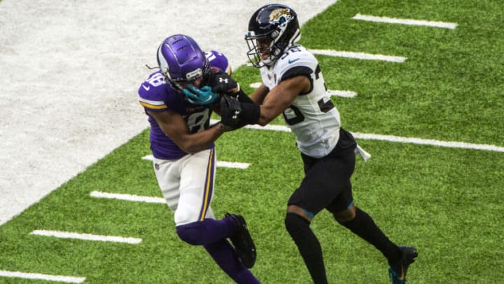 MINNEAPOLIS, MN - DECEMBER 6: Justin Jefferson #18 of the Minnesota Vikings catches the ball over defender Luq Barcoo #36 of the Jacksonville Jaguars in the third quarter of the game at U.S. Bank Stadium on December 6, 2020 in Minneapolis, Minnesota. (Photo by Stephen Maturen/Getty Images)
