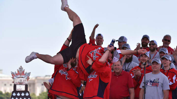 WASHINGTON, DC - JUNE 12: Washington Capitals right wing T.J. Oshie (77) is hoisted by his teammates as the Stanley Cup champions Washington Capitals hold their victory parade and rally on The National Mall on June 12, 2018 in Washington, D.C. (Photo by Ricky Carioti/The Washington Post via Getty Images)
