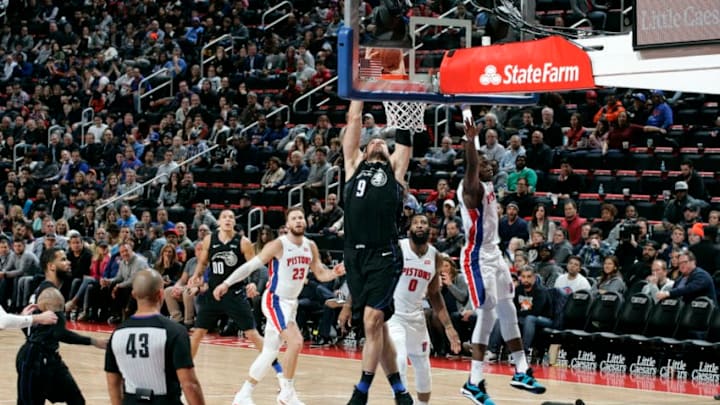 DETROIT, MI - JANUARY 16: Nikola Vucevic #9 of the Orlando Magic dunks against the Detroit Pistons on January 16, 2019 at Little Caesars Arena in Detroit, Michigan. NOTE TO USER: User expressly acknowledges and agrees that, by downloading and/or using this photograph, User is consenting to the terms and conditions of the Getty Images License Agreement. Mandatory Copyright Notice: Copyright 2019 NBAE (Photo by Brian Sevald/NBAE via Getty Images)