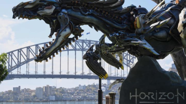 SYDNEY, AUSTRALIA - FEBRUARY 17: A statue of the Clawstrider against the backdrop of the Sydney Harbour Bridge at Bennelong Lawn on February 17, 2022 in Sydney, Australia. Australians are the first in the world to get up close and personal with the Clawstrider statue, now on display at the Royal Botanic Gardens beside Sydney Harbour. To celebrate the launch of Horizon Forbidden West, over the coming days Clawstrider statues will be appearing around the world, in some of the most iconic locations. Horizon Forbidden West is the sequel to the award-winning Horizon Zero Dawn and sees the protagonist, Aloy, venture into dangerous unknown territory, confronting a huge variety of new tribes and deadly machines in her quest to save the world once again. (Photo by James D. Morgan/Getty Images for PlayStation Australia)