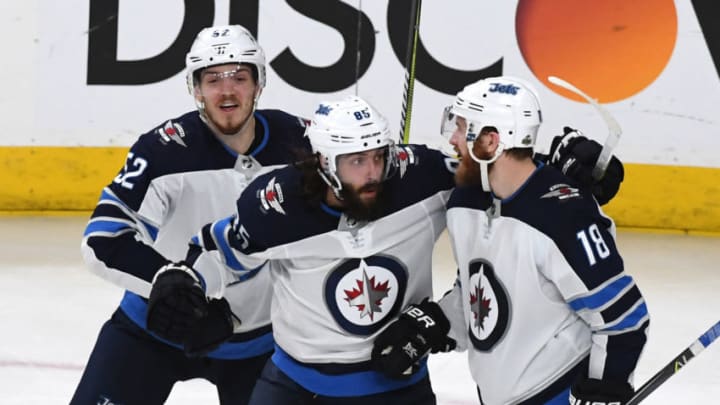 LAS VEGAS, NV - MAY 18: (L-R) Jack Roslovic #52, Mathieu Perreault #85 and Bryan Little #18 of the Winnipeg Jets celebrate after teammate Tyler Myers (not pictured) #57 scored a third-period goal against the Vegas Golden Knights in Game Four of the Western Conference Finals during the 2018 NHL Stanley Cup Playoffs at T-Mobile Arena on May 18, 2018 in Las Vegas, Nevada. The Golden Knights won 3-2. (Photo by Ethan Miller/Getty Images)