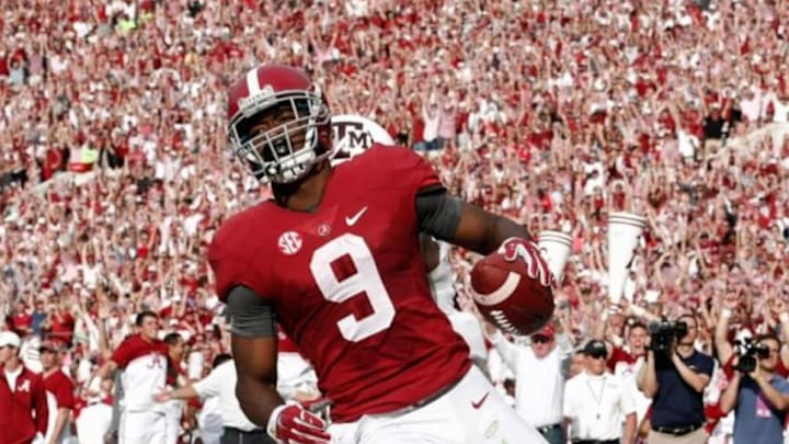 Oct 18, 2014; Tuscaloosa, AL, USA; Alabama Crimson Tide wide receiver Amari Cooper (9) catches a pass for a touchdown against the Texas A&M Aggies at Bryant-Denny Stadium. Mandatory Credit: Marvin Gentry-USA TODAY Sports
