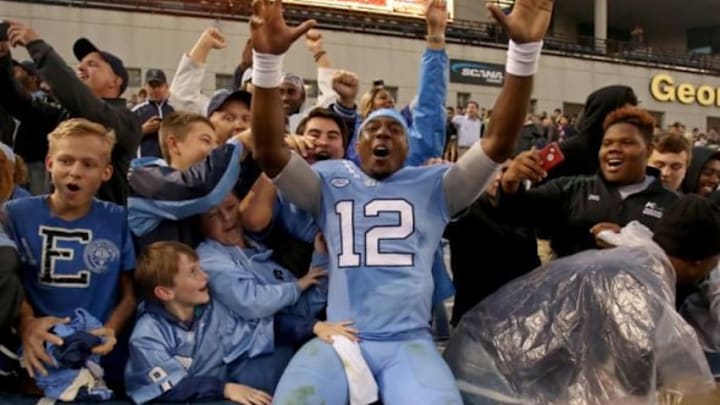 Oct 3, 2015; Atlanta, GA, USA; North Carolina Tar Heels quarterback Marquise Williams (12) celebrates with fans after their win over the Georgia Tech Yellow Jackets at Bobby Dodd Stadium. North Carolina won 38-31. Mandatory Credit: Jason Getz-USA TODAY Sports