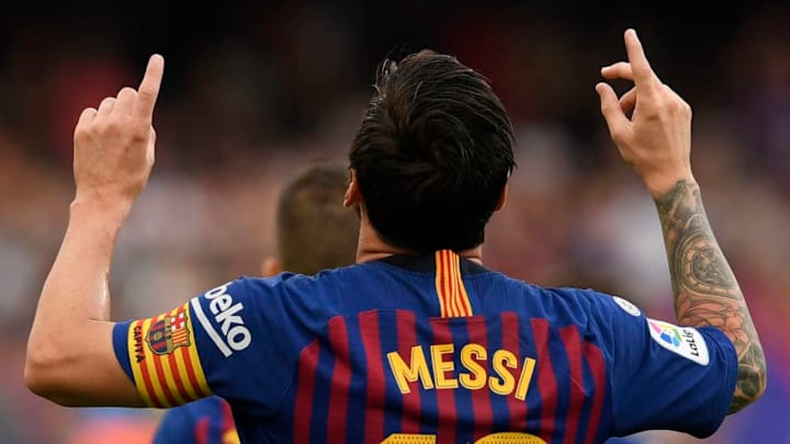 Barcelona's Argentinian forward Lionel Messi celebrates scoring his team's opening goal during the Spanish league football match between FC Barcelona and SD Huesca at the Camp Nou stadium in Barcelona on September 2, 2018. (Photo by LLUIS GENE / AFP) (Photo credit should read LLUIS GENE/AFP/Getty Images)