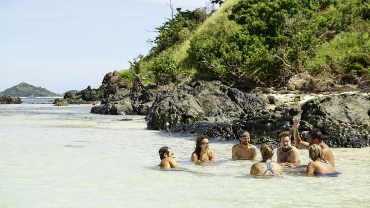 MANA ISLAND – MAY 1: ‘I’m the Kingpin’ – Hannah Shapiro, David Wright and Ezekiel/Zeke Smith lounge on the eighth episode of SURVIVOR: Millennials vs. Gen. X, airing Wednesday, Nov. 9 (8:00-9:00 PM, ET/PT) on the CBS Television Network. (Photo by Monty Brinton/CBS via Getty Images)