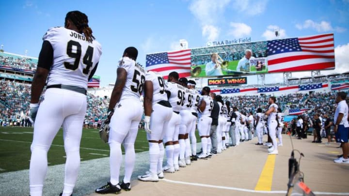 JACKSONVILLE, FLORIDA - OCTOBER 13: The New Orleans Saints standing for the national anthem before their game against the Jacksonville Jaguars at TIAA Bank Field on October 13, 2019 in Jacksonville, Florida. (Photo by Harry Aaron/Getty Images)