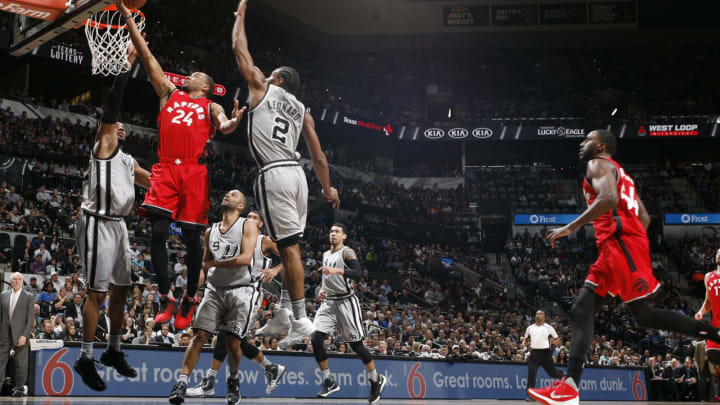 SAN ANTONIO, TX – APRIL 2: Norman Powell #24 of the Toronto Raptors goes for the layup against Kawhi Leonard #2 of the San Antonio Spurs during the game on April 2, 2016 at AT&T Center in San Antonio, Texas. NOTE TO USER: User expressly acknowledges and agrees that, by downloading and or using this Photograph, user is consenting to the terms and conditions of the Getty Images License Agreement. Mandatory Copyright Notice: Copyright 2016 NBAE (Photo by Chris Covatta/NBAE via Getty Images)