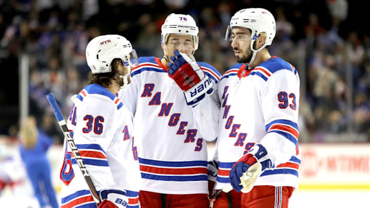 NEW YORK, NY - FEBRUARY 15: Mats Zuccarello #36, Brady Skjei #76 and Mika Zibanejad #93 of the New York Rangers have a conversation in the first period against the New York Islanders during their game at Barclays Center on February 15, 2018 in the Brooklyn borough of New York City. (Photo by Abbie Parr/Getty Images)