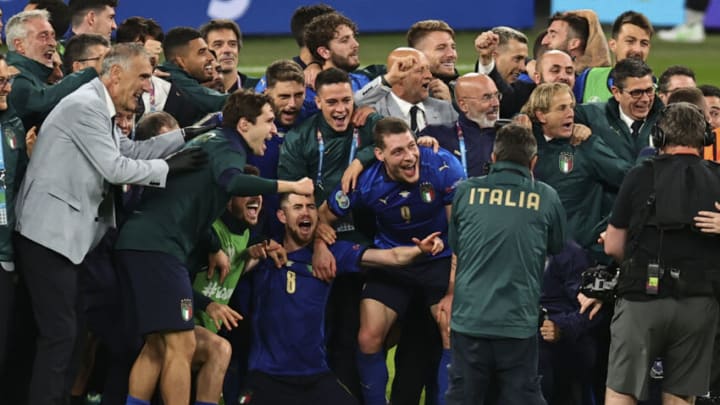 LONDON, UNITED KINGDOM - JULY 06: Players and technical squad of Italy celebrate after defeating Spain within the penatly kicks in the EURO 2020 semi-final football match at Wembley Stadium in London, United Kingdom on July 06, 2021. (Photo by Ali Balikci/Anadolu Agency via Getty Images)