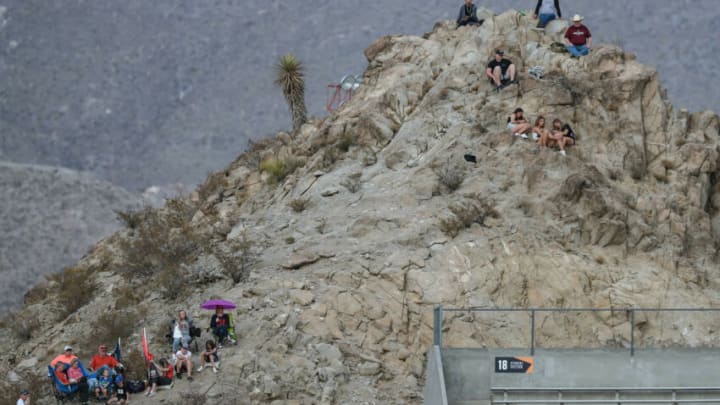 Fans hike the mountain behind the Sun Bowl stadium to watch New Mexico State take on Dixie State at the Sun Bowl