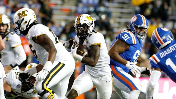 Missouri Tigers running back Larry Rountree III (34) cut through a hole in the defense during a game against the Florida Gators at Ben Hill Griffin Stadium in Gainesville, Fla. Oct. 31, 2020. [Brad McClenny/The Gainesville Sun]Florida Missouri 40