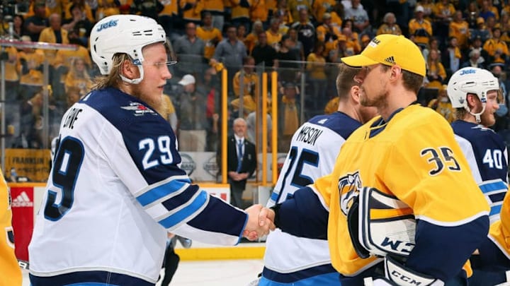 NASHVILLE, TN - MAY 10: Pekka Rinne #35 of the Nashville Predators congratulates Patrik Laine #29 of the Winnipeg Jets after a 5-1 Jets Victory in Game Seven of the Western Conference Second Round during the 2018 NHL Stanley Cup Playoffs at Bridgestone Arena on May 10, 2018 in Nashville, Tennessee. (Photo by Frederick Breedon/Getty Images) NASHVILLE, TN - MAY 10: Pekka Rinne #35 of the Nashville Predators congratulates Patrik Laine #29 of the Winnipeg Jets after a 5-1 Jets Victory in Game Seven of the Western Conference Second Round during the 2018 NHL Stanley Cup Playoffs at Bridgestone Arena on May 10, 2018 in Nashville, Tennessee. (Photo by Frederick Breedon/Getty Images)