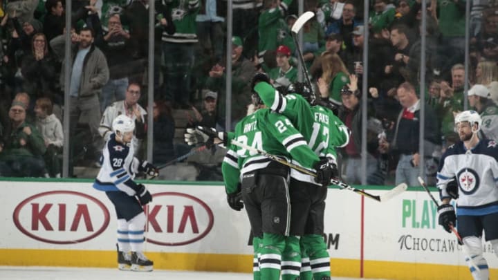 DALLAS, TX - JANUARY 19: Radek Faksa #12, Roope Hintz #24 and the Dallas Stars celebrate a goal against the Winnipeg Jets at the American Airlines Center on January 19, 2019 in Dallas, Texas. (Photo by Glenn James/NHLI via Getty Images)