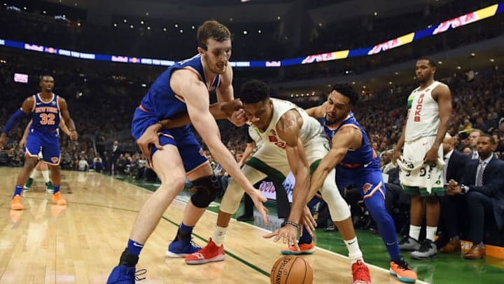 MILWAUKEE, WISCONSIN - DECEMBER 27: Giannis Antetokounmpo #34 of the Milwaukee Bucks is defended by Luke Kornet #2 and Courtney Lee #5 of the New York Knicks during the first half of a game at Fiserv Forum on December 27, 2018 in Milwaukee, Wisconsin. NOTE TO USER: User expressly acknowledges and agrees that, by downloading and or using this photograph, User is consenting to the terms and conditions of the Getty Images License Agreement. (Photo by Stacy Revere/Getty Images)