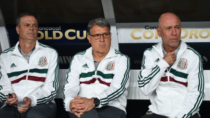 Mexico's coach Gerardo 'Tata' Martino (C) sits on the team bench at the start of the CONCACAF Gold Cup Group A match between Mexico and Canada on June 19, 2019 at Broncos Mile High stadium in Denver, Colorado. (Photo by Robyn Beck / AFP) (Photo credit should read ROBYN BECK/AFP/Getty Images)