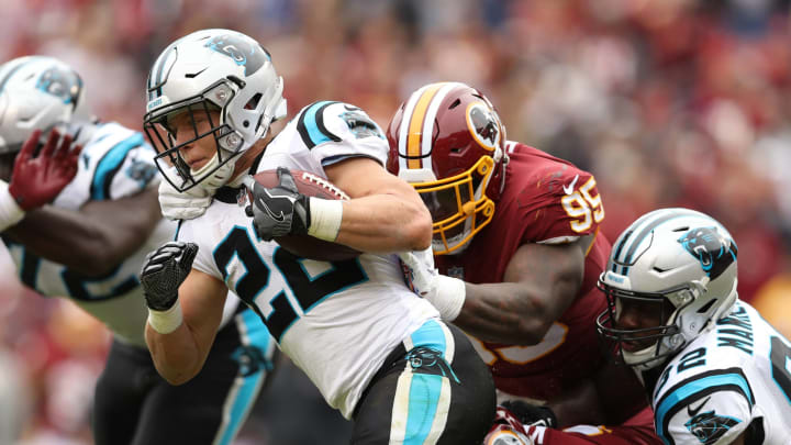 LANDOVER, MD – OCTOBER 14: Running back Christian McCaffrey #22 of the Carolina Panthers is tackled by defensive tackle Da’Ron Payne #95 of the Washington Redskins in the second quarter at FedExField on October 14, 2018 in Landover, Maryland. (Photo by Patrick Smith/Getty Images)