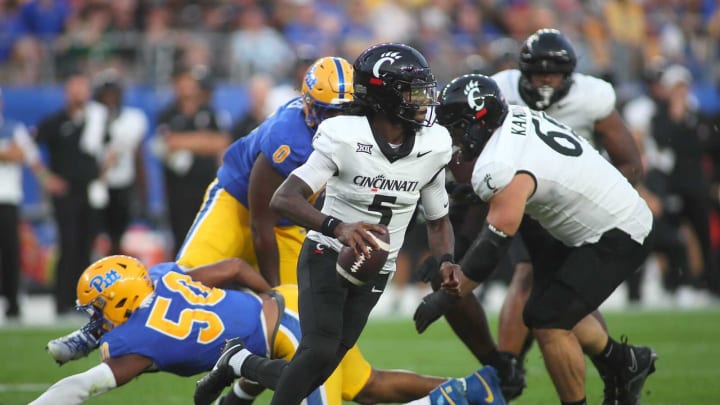 Cincinnati Bearcats quarterback Emory Jones (5) scrambles in the backfield during the first half against the Pittsburgh Panthers at Acrisure Stadium in Pittsburgh, PA on September 9, 2023