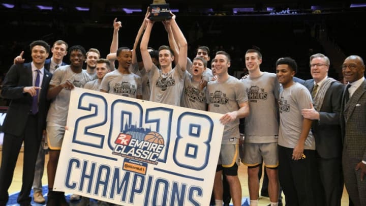 NEW YORK, NEW YORK - NOVEMBER 16: The Iowa Hawkeyes celebrate the win of the championship game against the Connecticut Huskies during the 2K Empire Classic at Madison Square Garden on November 16, 2018 in New York City. (Photo by Sarah Stier/Getty Images)