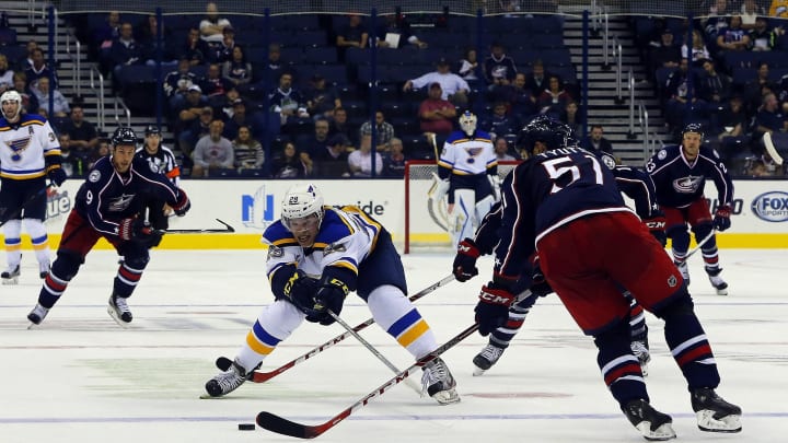 Sep 22, 2015; Columbus, OH, USA; St. Louis Blues defenseman Vince Dunn (29) reaches for the puck against the Columbus Blue Jackets during the third period at Nationwide Arena. Columbus won 3-1. Mandatory Credit: Russell LaBounty-USA TODAY Sports
