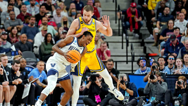 Mar 24, 2022; San Antonio, TX, USA; Villanova Wildcats forward Brandon Slater (3) drives to the basket against Michigan Wolverines center Hunter Dickinson (1) in the semifinals of the South regional of the men's college basketball NCAA Tournament at AT&T Center. Mandatory Credit: Daniel Dunn-USA TODAY Sports