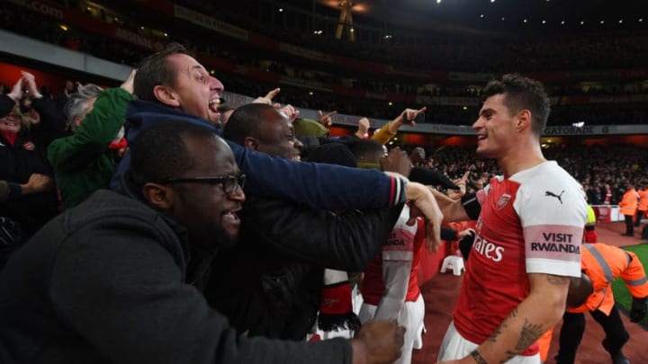 LONDON, ENGLAND - NOVEMBER 03: Granit Xhaka celebrates the Arsenal goal with the fans during the Premier League match between Arsenal FC and Liverpool FC at Emirates Stadium on November 3, 2018 in London, United Kingdom. (Photo by Stuart MacFarlane/Arsenal FC via Getty Images)