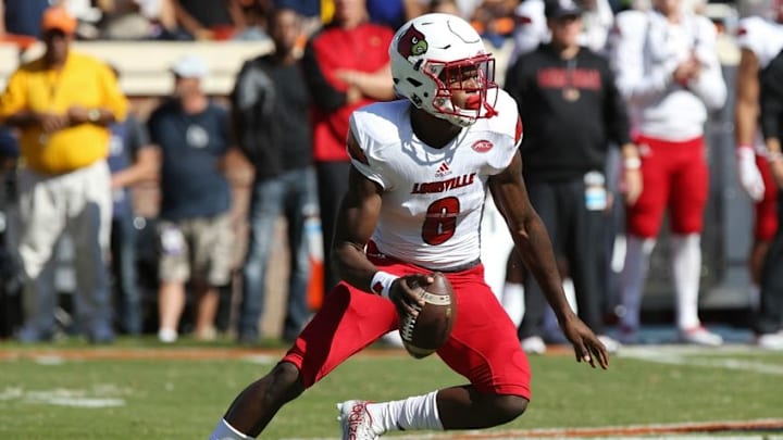 Oct 29, 2016; Charlottesville, VA, USA; Louisville Cardinals quarterback Lamar Jackson (8) runs with the ball against the Virginia Cavaliers at Scott Stadium. Mandatory Credit: Geoff Burke-USA TODAY Sports