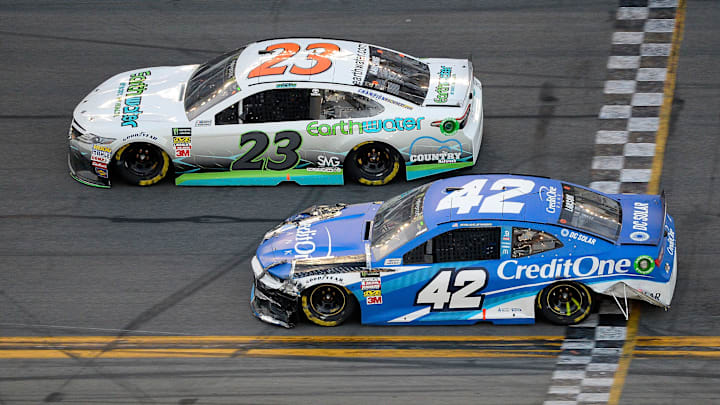 DAYTONA BEACH, FL – FEBRUARY 18: Gray Gaulding, driver of the #23 Toyota, races Kyle Larson, driver of the #42 Credit One Bank Chevrolet (Photo by Robert Laberge/Getty Images)