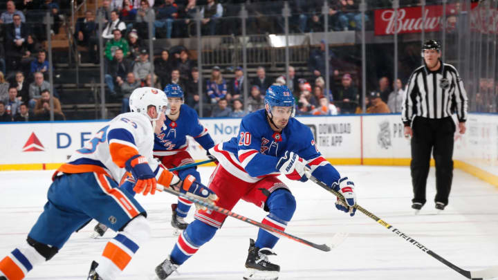 Chris Kreider #20 of the New York Rangers skates with the puck against the New York Islanders